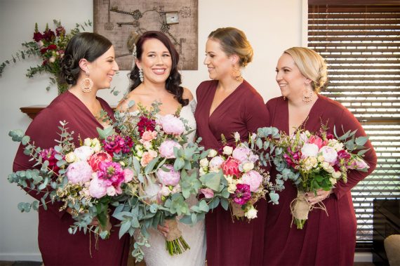 Bride with bridesmaids and flowers